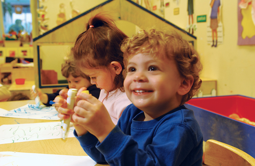 child smiling in classroom